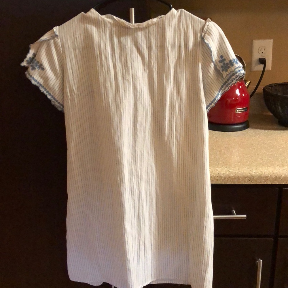 White and blue stripped shirt